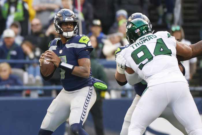 Jan 1, 2023; Seattle, Washington, USA; Seattle Seahawks quarterback Geno Smith (7) looks to pass against the New York Jets during the third quarter at Lumen Field.